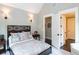 Comfortable bedroom featuring modern decor, ceiling fan, and views of the surrounding landscape at 127 Blue Heron Pond Rd # A, Kiawah Island, SC 29455