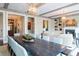 Spacious dining area with a large table, comfortable seating, stylish lighting, and seamlessly connecting to the living area at 127 Blue Heron Pond Rd # A, Kiawah Island, SC 29455
