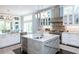 Beautiful kitchen featuring an island, stainless steel appliances, and light-filled windows at 127 Blue Heron Pond Rd # A, Kiawah Island, SC 29455