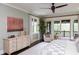 Spacious main bedroom featuring a ceiling fan, dresser, and access to a balcony at 127 Blue Heron Pond Rd # A, Kiawah Island, SC 29455