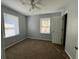 Bright bedroom with two windows and a ceiling fan for optimal comfort at 139 Stephanie Cir, Summerville, SC 29483