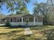 Charming single-story home with a cozy front porch and well-maintained lawn at 139 Stephanie Cir, Summerville, SC 29483