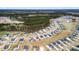 Aerial view of home nestled in a meticulously designed community with serene surroundings at 1420 Homecoming Blvd, Ravenel, SC 29470