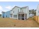 Well-maintained backyard featuring a screened porch, offering a private outdoor space at 1420 Homecoming Blvd, Ravenel, SC 29470