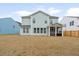 Exterior of home with screened porch in backyard; ideal for entertaining or quiet enjoyment at 1420 Homecoming Blvd, Ravenel, SC 29470