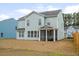 View of backyard with spacious screened porch, blending indoor-outdoor living seamlessly at 1420 Homecoming Blvd, Ravenel, SC 29470