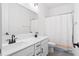 Bathroom featuring double sink vanity, white cabinets and modern fixtures at 1420 Homecoming Blvd, Ravenel, SC 29470