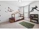 room featuring a wooden house bed, decorative wall decals, and carpet at 1420 Homecoming Blvd, Ravenel, SC 29470