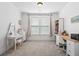 Bright bedroom features plush carpet, natural light, and an open design at 1420 Homecoming Blvd, Ravenel, SC 29470
