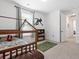 room featuring a wooden house bed, decorative wall decals, carpet and bookshelf at 1420 Homecoming Blvd, Ravenel, SC 29470