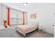 Bright bedroom with plush carpet, large window, and stylish, colorful accents at 1420 Homecoming Blvd, Ravenel, SC 29470