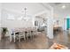 Open dining room and kitchen area offer plenty of space for entertaining at 1420 Homecoming Blvd, Ravenel, SC 29470