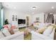 Bright living room with comfortable seating, modern decor, and staircase access at 1420 Homecoming Blvd, Ravenel, SC 29470