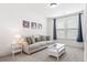 Bright living room featuring a comfortable couch, carpet, and natural light at 1420 Homecoming Blvd, Ravenel, SC 29470