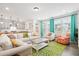 Open-concept living room flows seamlessly from the kitchen, offering ample seating and natural light at 1420 Homecoming Blvd, Ravenel, SC 29470