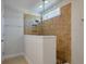Tiled walk-in shower with glass partition featuring a rainfall shower head and a built-in niche at 1457 Red Tide Rd, Mount Pleasant, SC 29466