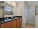 Bathroom featuring a double vanity with granite countertops, and a shower and bath in the background at 1457 Red Tide Rd, Mount Pleasant, SC 29466