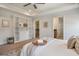 Bedroom with a comfortable bed, open shelving, and a view into the en-suite bath and walk in closet at 1457 Red Tide Rd, Mount Pleasant, SC 29466