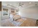 Bright bedroom with a tray ceiling, a ceiling fan, and a large window, creating a peaceful retreat at 1457 Red Tide Rd, Mount Pleasant, SC 29466