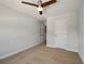 Cozy bedroom with neutral carpet, ceiling fan, and two doors at 1457 Red Tide Rd, Mount Pleasant, SC 29466