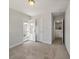 Bright bedroom with carpet, white trim, access to the porch and a connecting door to other rooms at 1457 Red Tide Rd, Mount Pleasant, SC 29466
