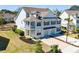 A charming two-story home, with an attractive facade, private garages and landscaped surroundings at 1457 Red Tide Rd, Mount Pleasant, SC 29466