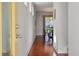 Bright hallway featuring hardwood floors, leading to a dining area, creating a welcoming and open feel at 1457 Red Tide Rd, Mount Pleasant, SC 29466