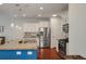 Kitchen with a large island, stainless steel appliances, white cabinets, and modern pendant lighting at 1457 Red Tide Rd, Mount Pleasant, SC 29466
