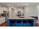 Kitchen featuring a granite island with seating, stainless appliances, and ample white cabinetry for storage at 1457 Red Tide Rd, Mount Pleasant, SC 29466