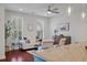 Bright living room with hardwood floors, comfortable seating, and a view of the modern kitchen at 1457 Red Tide Rd, Mount Pleasant, SC 29466