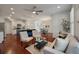Spacious living area with hardwood floors, complemented by a modern kitchen and comfortable seating at 1457 Red Tide Rd, Mount Pleasant, SC 29466