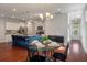 Open-concept kitchen and dining area with stylish island, modern appliances, and hardwood floors at 1457 Red Tide Rd, Mount Pleasant, SC 29466