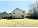 Exterior view of a two-story home highlighting its spacious backyard and patio at 148 Saint Charles Way, Goose Creek, SC 29445