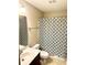 Cozy bathroom with a pattern shower curtain, cream colored wall, and tile flooring at 148 Saint Charles Way, Goose Creek, SC 29445