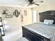 Bedroom featuring a large bed, decor on the wall, a ceiling fan, and carpet at 148 Saint Charles Way, Goose Creek, SC 29445