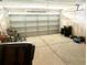 Unfinished garage with a white door, concrete floor, and some chairs at 148 Saint Charles Way, Goose Creek, SC 29445