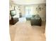 Comfortable living room with neutral carpet, a dark gray sectional sofa, and sliding glass doors leading to the backyard at 148 Saint Charles Way, Goose Creek, SC 29445