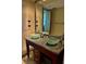 Bathroom with double sink vanity with granite countertop and glass bowl sinks at 150 Bee St # 713, Charleston, SC 29401