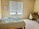 Cozy bedroom with a large window providing natural light, and neutral tones at 150 Bee St # 713, Charleston, SC 29401