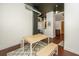 An industrial dining space with high ceilings and wood table set on rug at 150 Bee St # 713, Charleston, SC 29401