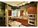 Modern kitchen featuring stainless steel appliances and wooden cabinets at 150 Bee St # 713, Charleston, SC 29401