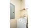 Washer and dryer hook ups in laundry area with shelves and electrical panel at 150 Bee St # 713, Charleston, SC 29401