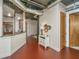 Living room with hardwood flooring and a modern style entryway to kitchen at 150 Bee St # 713, Charleston, SC 29401
