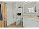 Bright bathroom with a shower and tub combo, white vanity, and a large mirror, offering a clean and modern space at 1522 Telfair Way, Charleston, SC 29412