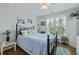 Comfortable bedroom with a wrought iron bed, plantation shutters, and ample natural light for a relaxing retreat at 1522 Telfair Way, Charleston, SC 29412