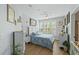 Charming bedroom with hardwood floors, white furniture, and calming decor at 1522 Telfair Way, Charleston, SC 29412