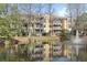 Gorgeous condo building reflected in the serene pond with fountain at 1522 Telfair Way, Charleston, SC 29412