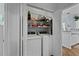 Convenient laundry closet with a washer and dryer and shelving for storage at 1522 Telfair Way, Charleston, SC 29412