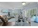 Cozy living area with a ceiling fan, wood floors, and a balcony at 1522 Telfair Way, Charleston, SC 29412