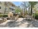 Inviting outdoor patio with a fireplace, seating, and dining area, perfect for entertaining and enjoying outdoor living at 1522 Telfair Way, Charleston, SC 29412